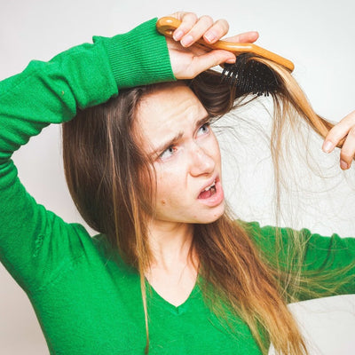 Why Is My Hair Falling Out? Here’s What’s Normal Shedding—and What’s Not