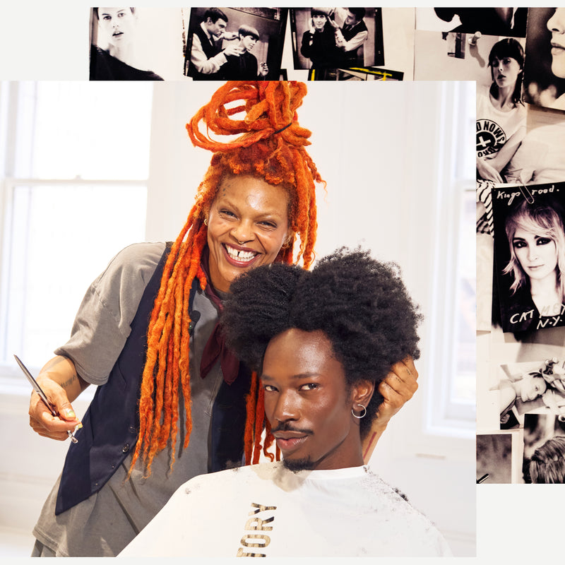 Man having his coily hair styled by a hairstylist